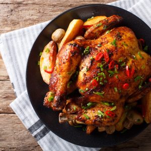 Baked,Whole,Chicken,With,Mushrooms,And,Potatoes,Close-up,On,A